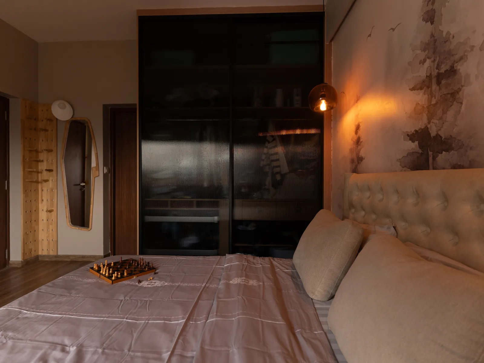 Bedroom with black glass wardrobe and tufted bed — Amlan's Residence